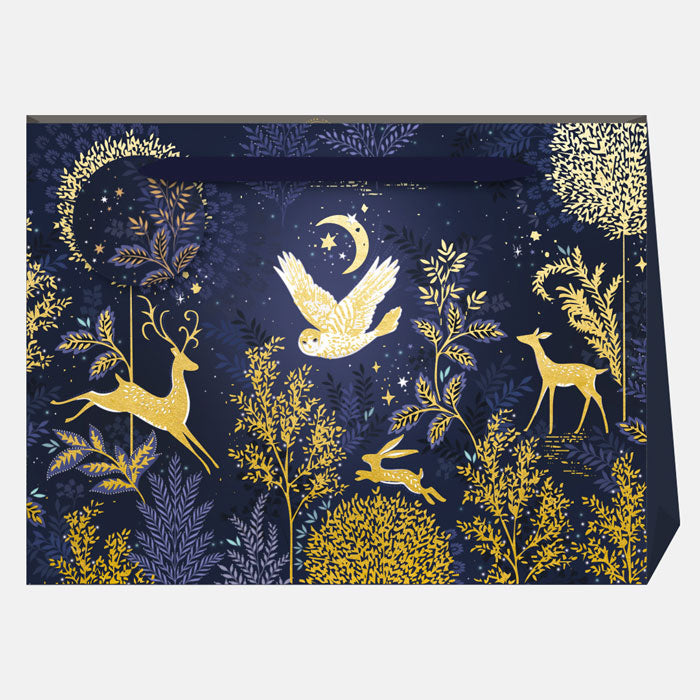Decorative gift bag with gold woodland animal illustrations on a blue background