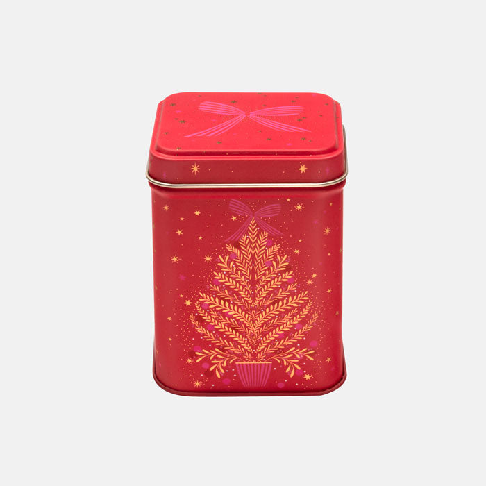 A red square metal tin with a lid, decorated with a gold Christmas tree and gold stars.
