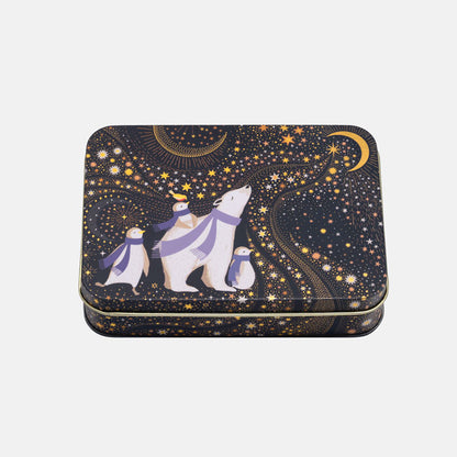 A rectangular metal tin with rounded corners, featuring a whimsical winter night sky design. The design has a dark navy blue background filled with gold stars, a gold crescent moon, and a polar bear family with purple scarves.