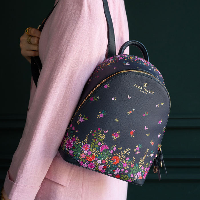 Model wearing bag on back, can see scale.
