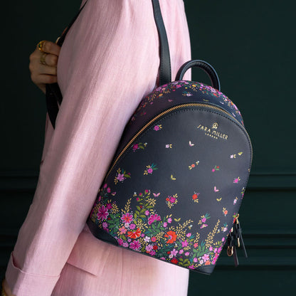Model wearing bag on back, can see scale.