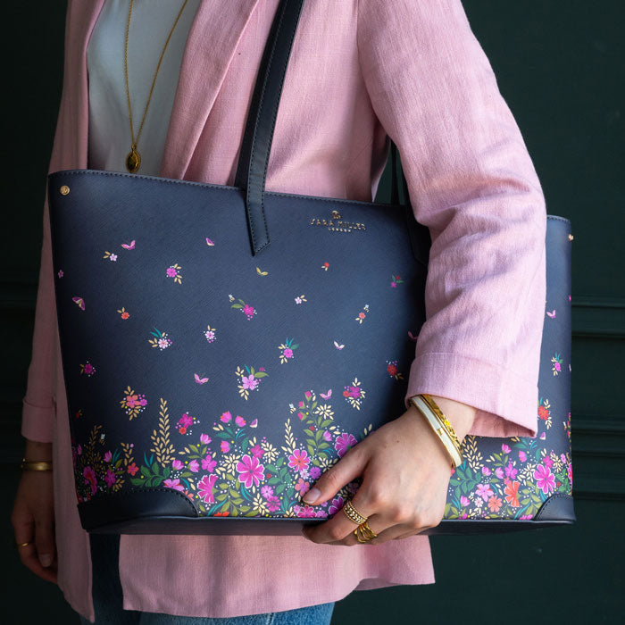 Model wearing bag with complementing pink tones in outfit. Shows scale.