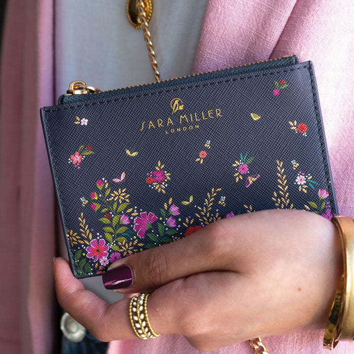 Model holding card holder, can see scale.