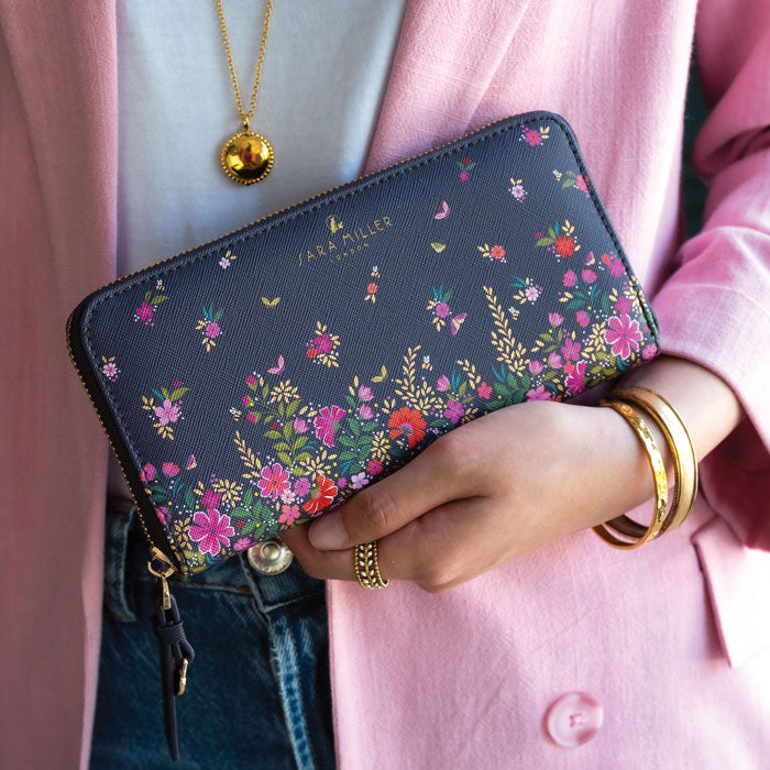 Model holding purse, can see scale.