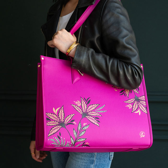 Pink Boxy Tote bag worn by model, moody background colours.