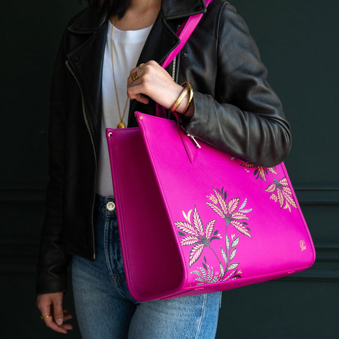 Pink Boxy Tote bag worn by model, moody background colours.