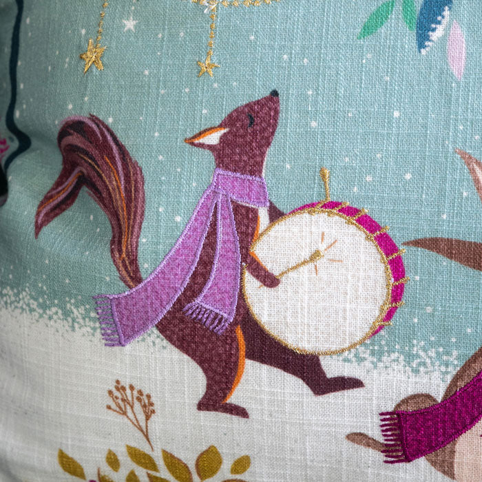 Close up of linen texture and embroidered detail.