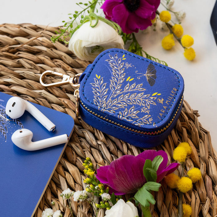 Cobalt earphones pouch with butterfly design and gold embellished details, and gold clip to attach to your bag.