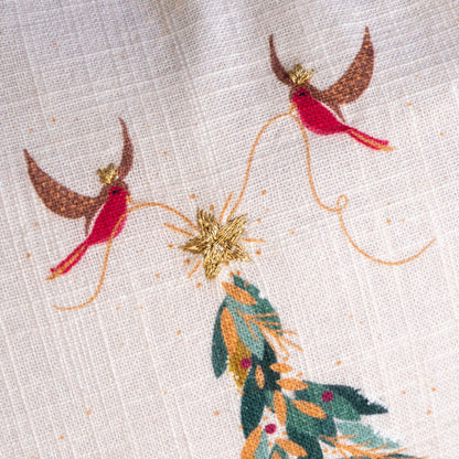 Embroidered design of two robins on a branch with a star and green leaves on a beige background.