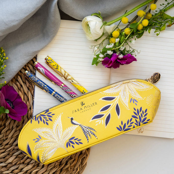 Yellow pencil case with botanic blooms design and gold detailing.