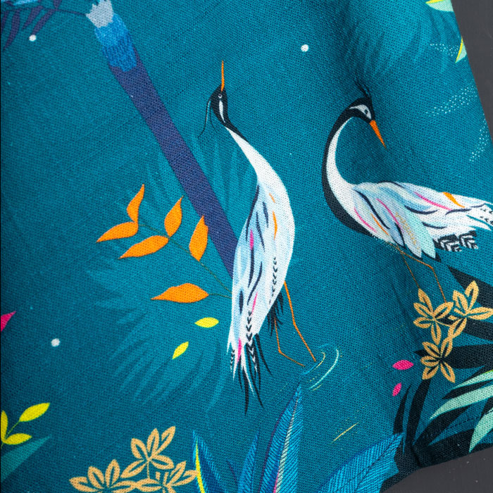Teal tea towel with heron design.