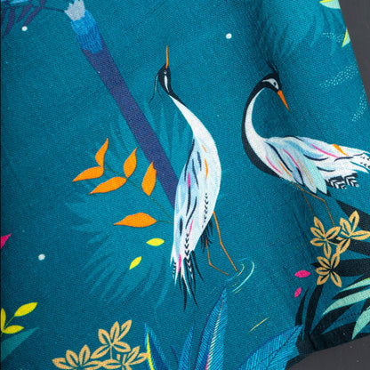 Teal tea towel with heron design.