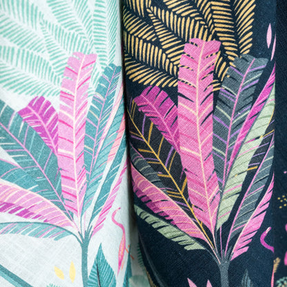 Navy tea towel with flamingo and palm design.