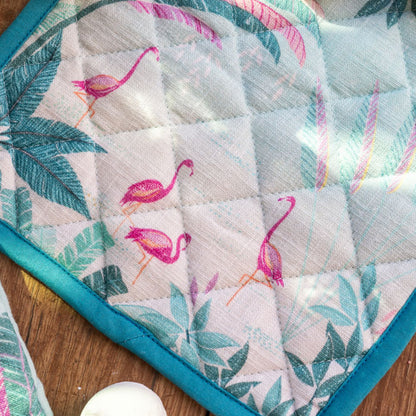 Pot holder with flamingo and palm design in pinks and blues.