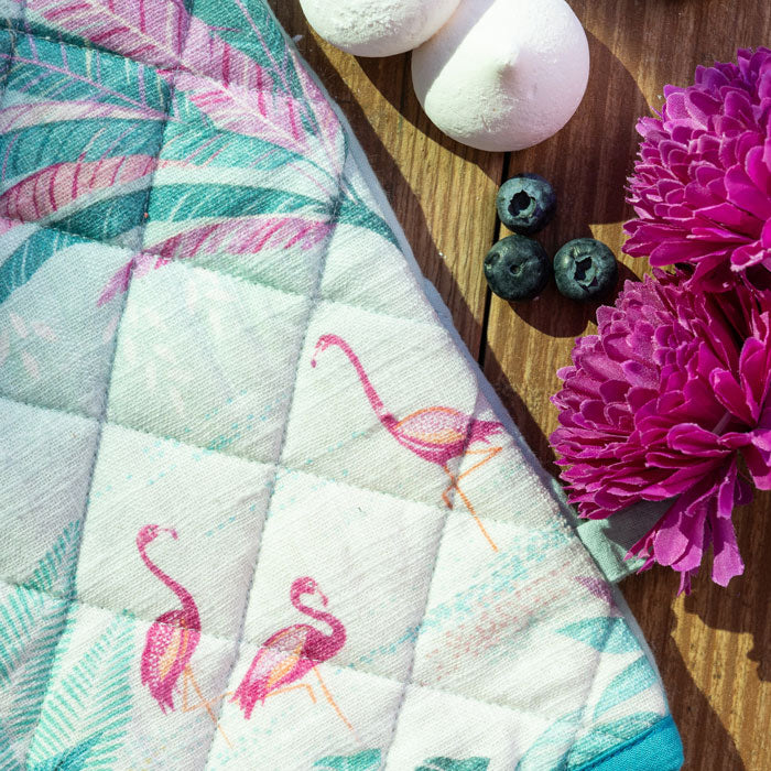 Close up of flamingo and palm pattern with linen texture.