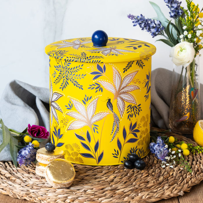 Biscuit barrel in warm yellow colour, with botanic blooms design and gold detailing.