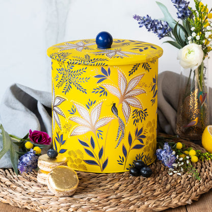 Biscuit barrel in warm yellow colour, with botanic blooms design and gold detailing.