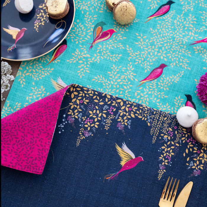 Close up on the placemat, can see linen texture and design.