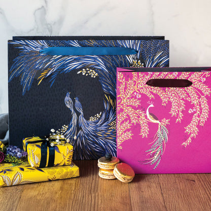 Two gift bags, one indigo and one pink from our anniversary collection.
