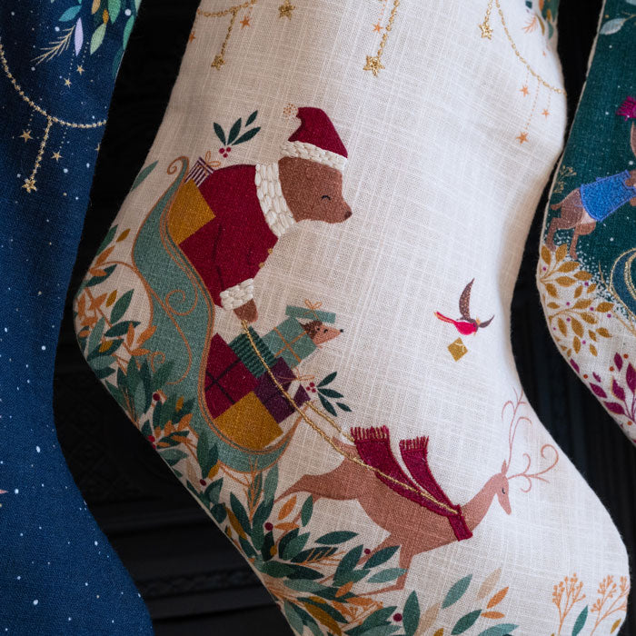 Decorative Christmas stocking with festive design on a cream background