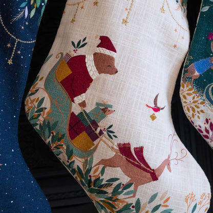 Decorative Christmas stocking with festive design on a cream background