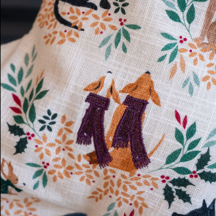 Christmas stocking with dogs and foliage design.