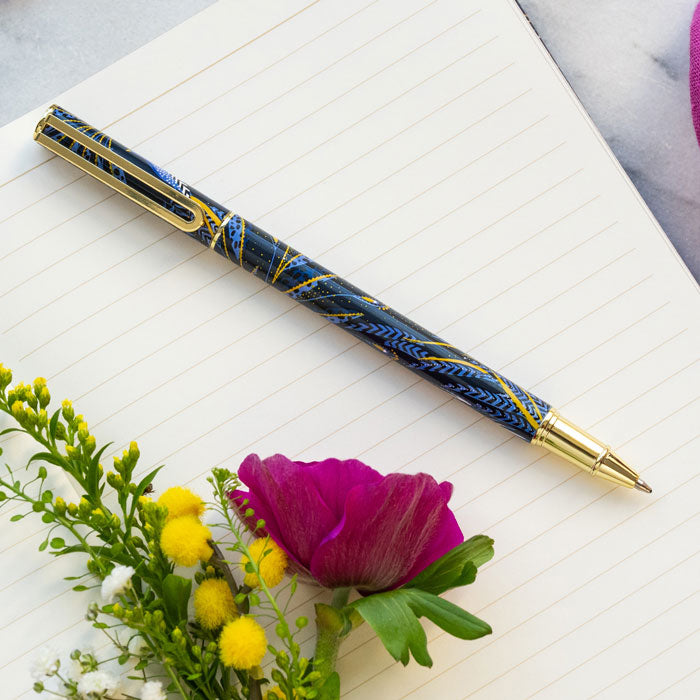 Ballpoint pen presented in box, with peacock feathers design in indigo and gold.