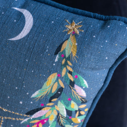 Embroidered design on a blue fabric with a celestial theme, including a moon and star.