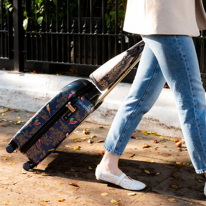 Somebody wheeling the cabin case with. the matching handbag.