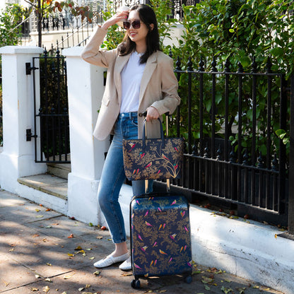 Somebody holding the cabin case and the matching handbag.