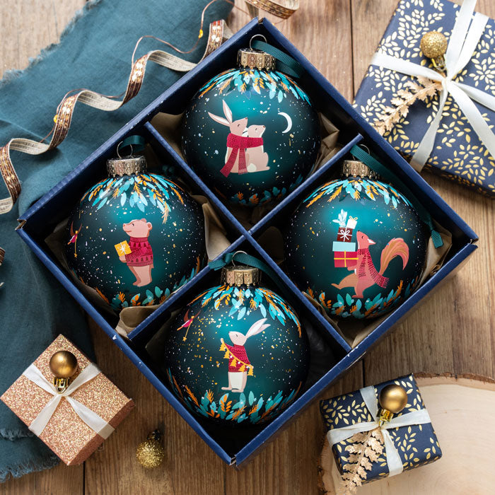 Set of decorative Christmas ornaments in a box with festive background