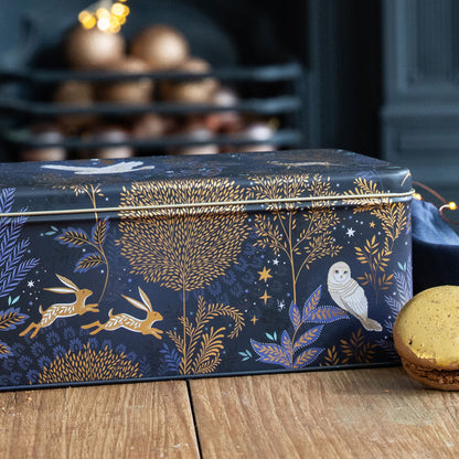 Decorative box with moonlit forest design on a wooden surface