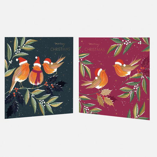Two Christmas-themed greeting cards in blue and red with birds and foliage on a white background.