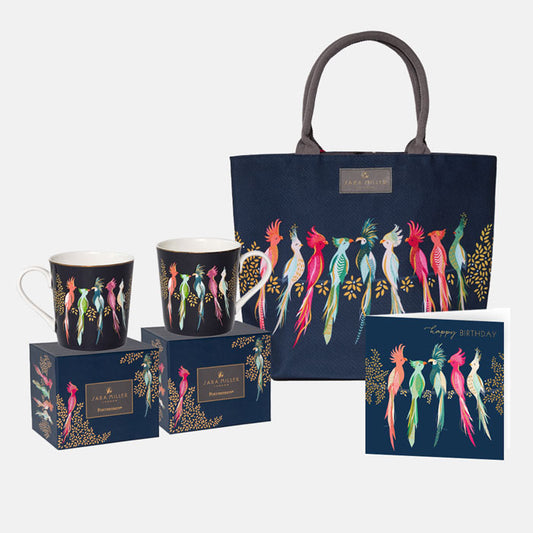 Navy blue tote bag, mugs, and card with colorful bird design on a white background