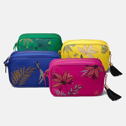 Four bags together from the collection in yellow, pink, blue and green.