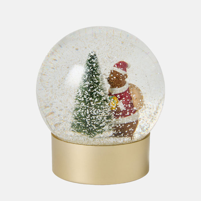 Snow globe with a bear and Christmas tree inside on a white background